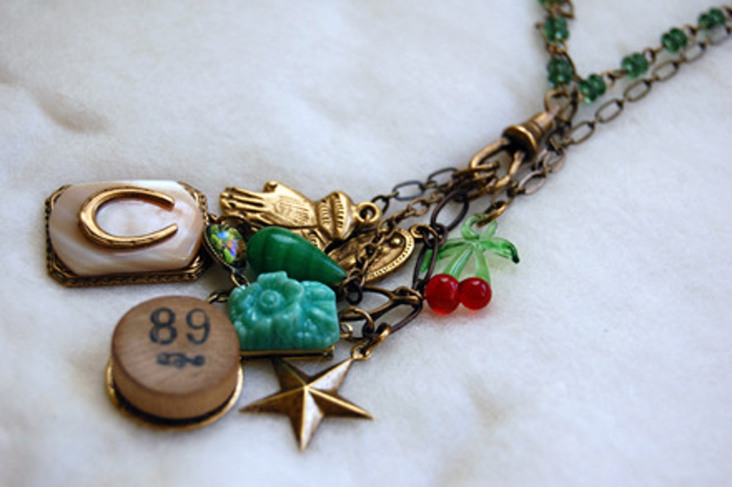 <p>a charm, talisman</p>