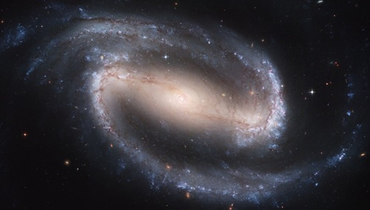 <p>great cloud of stars, gas, and dust bound together by the combined gravity of all the matter<br>ex- the one that Earth is in is called the Milky Way which has graceful spiral arms winding outward through the disk<br>&gt; 80 000 ly in diameter and contains over 100 billion stars</p>