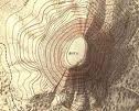 show elevation of land with shape and spacing of contour lines; closer lines mean steeper slopes; flat places have widely spaced lines; series of increasingly smaller closed loops indicates hill or mountain