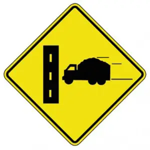 <p>truck entrance on the right side of the road</p>