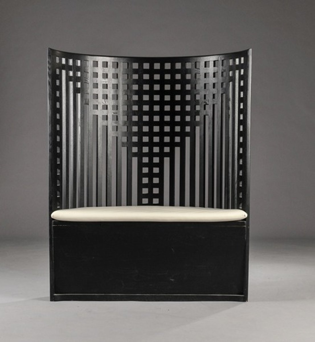 <p>Has lots of grid, straight lines and squares<br>abstracted willow tree is in the chair back</p>