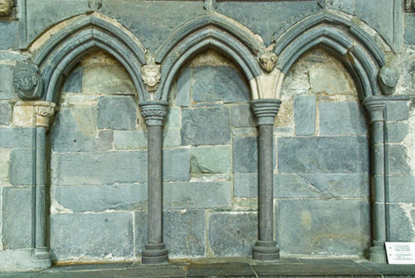 <p>In architecture, an arcade( a series of arches carried by columns or piers) having no actual openings, applied as decoration to a wall surface</p>
