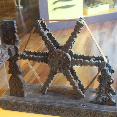 <p>curvillienar motifs inspired by nature, seen in this spinning wheel</p>