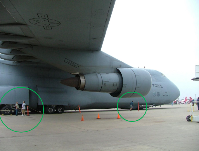 <p>Aircraft can be very large. The aircraft shown is a Lockheed C-5 Galaxy. The people shown in the image demonstrate the scale of the aircraft.</p>