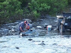 <p>Process of looking for metals and precious stones in river sediments</p>