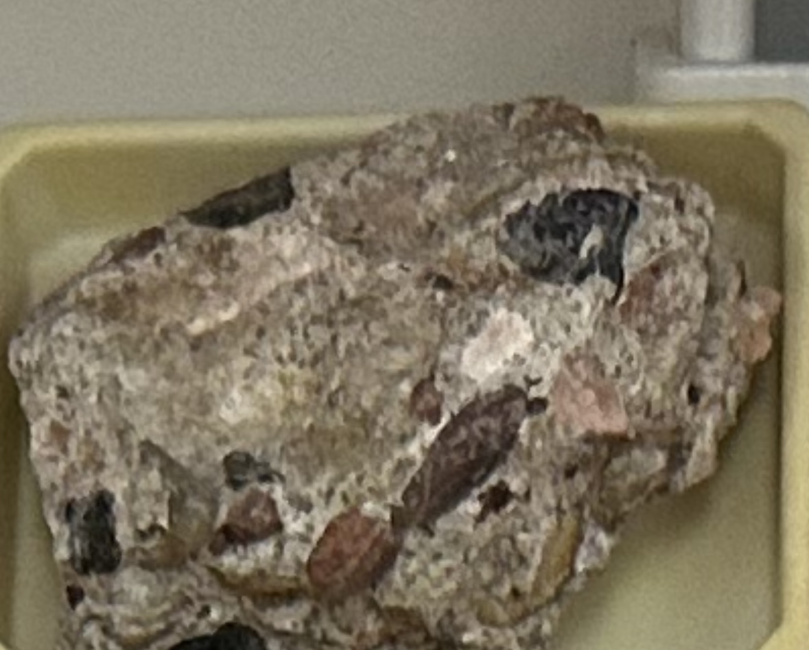 <p><strong><u>CLASTIC/DETRITAL</u></strong></p><p><strong>GRAIN:</strong></p><p>size— &gt;2mm gravel, shape— rounded grains, sorting— poorly-sorted</p><p><strong>HCI: </strong>reaction</p><p><strong>ENVIRONMENT:</strong> continental (river/stream channel)</p><p><strong>CEMENT:</strong> calcite</p><p><strong>POROUS:</strong> yes</p><p><strong>MINERAL(S): </strong>quartz, feldspar, rock and/or clay minerals</p><p><strong>OTHER:</strong> very chunky, generally poorly sorted fragments</p>