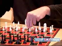 (n) in chess, an opening move that involves risk or sacrifice of a minor piece in order to gain a later advantage; any opening move of this type