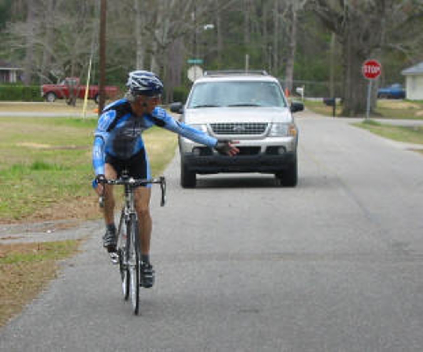 <p>This cyclist is signaling to __________.</p>