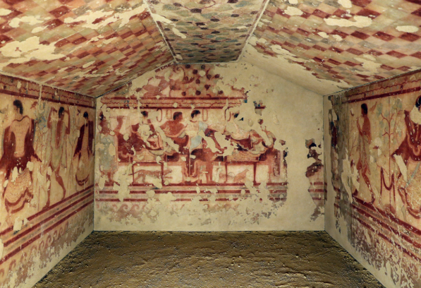 <p>Etruscan. 470 BCE. Etruscan tombs contained both the deceased and offerings/goods. Were painted with vivid frescos. This particular one depicts a banquet. Etruscan funeral rites were not somber in nature, but festive instead. </p>