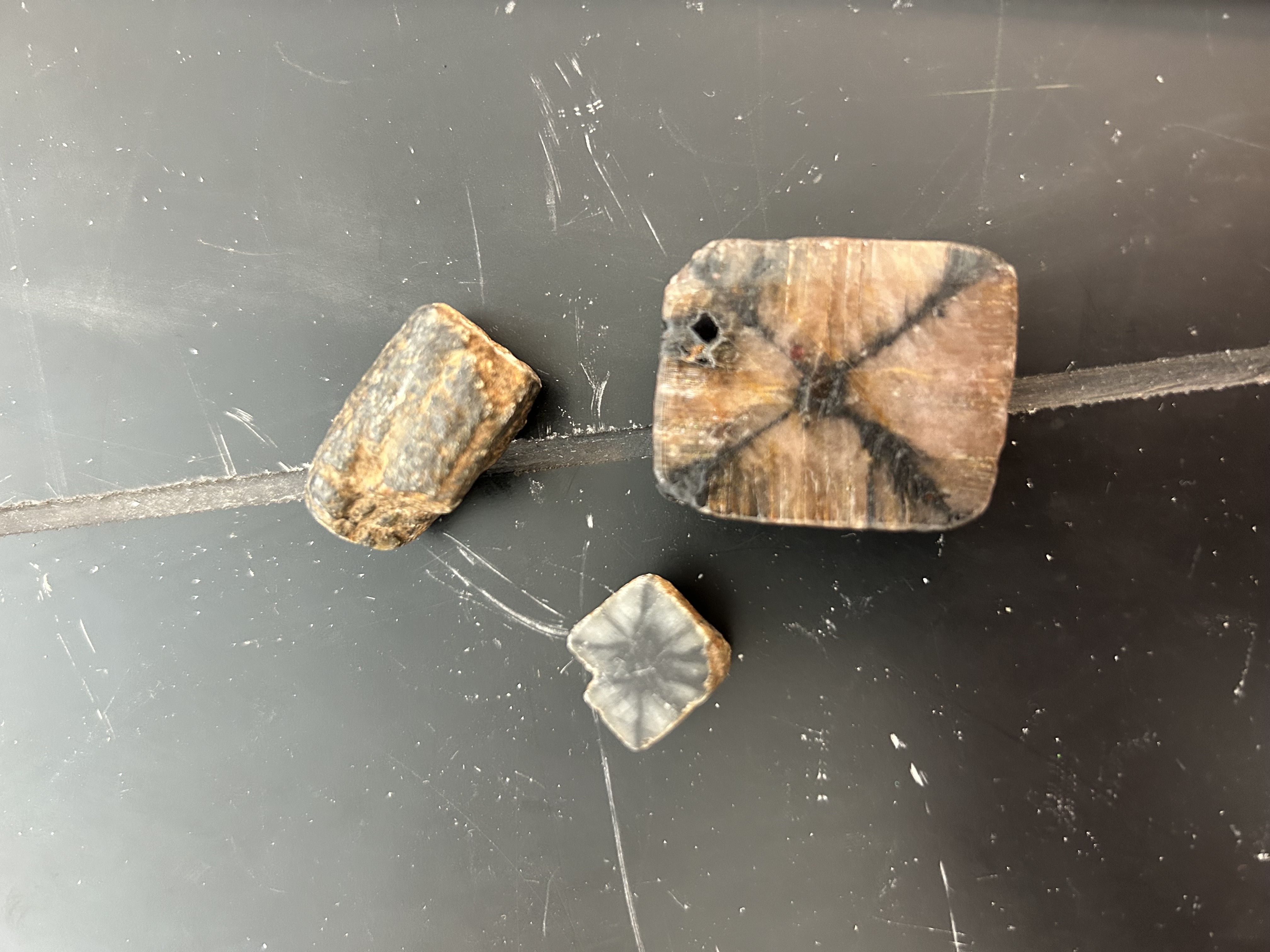 <p>X</p><p><span>Andalusite offers a variety of muted colors (pink, salmon-red, pale brown, green, yellow or white) that reflect an iridescent quality, where the surface changes color depending on the angle at which it is viewed or illuminated.</span></p>