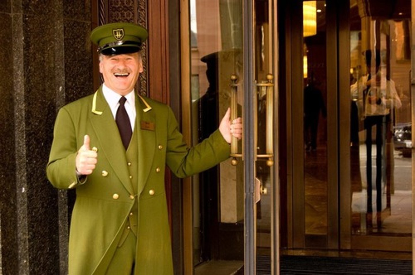 <p>doorman, door person</p>