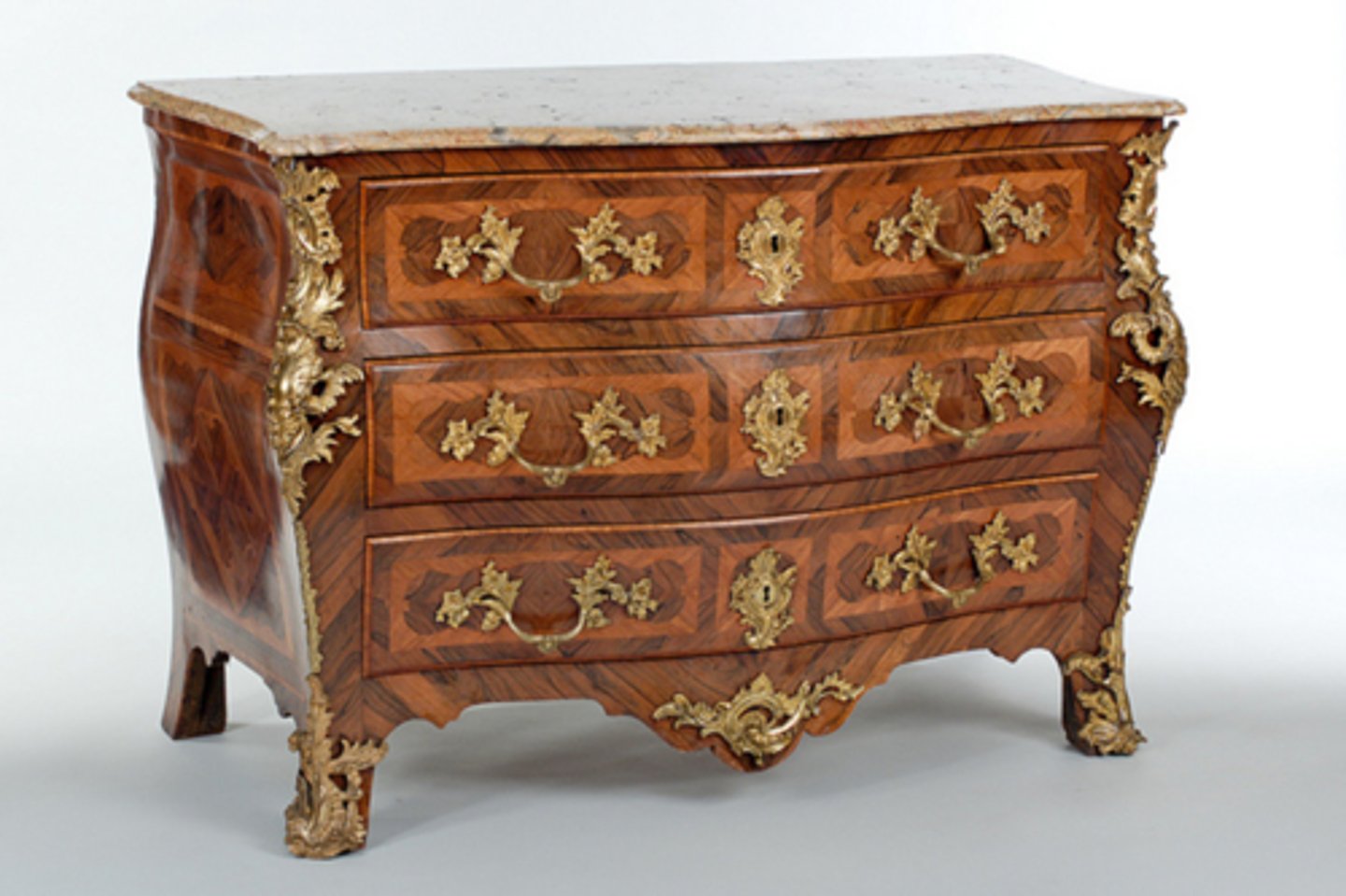 <p>serpentine top</p><p>marquetry</p><p>trelles design</p><p>crossbanding around panel on outside</p><p>gilt brass mounts</p><p>sabot feet</p><p>heavier piece</p>