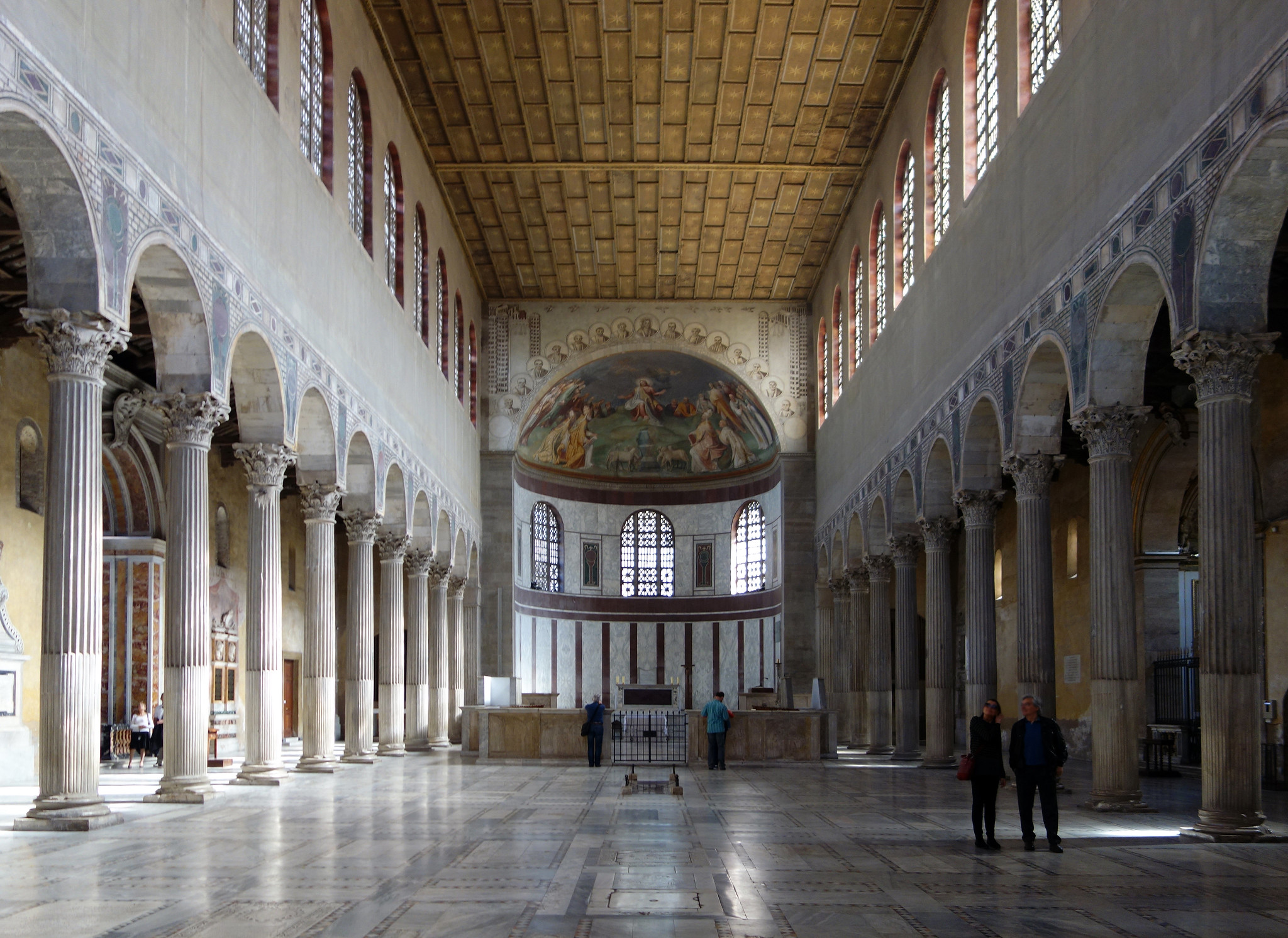 <p>-c. 432 C.E. Rome, wooden truss roof, shows what the original St. Peter&apos;s Basilica looked like.</p><ul><li><p>Central axis that leads from the entrance to the apse. Nave has clerestory windows for direct lighting, the &quot;glass&quot; of the windows is actually gypsum. The visual aspects of the column guide to the alter, does not have a transept</p></li><li><p>columns and pilasters form verticals that tie together different levels, does not support the building, it visualizes the weight</p></li><li><p>the allowance of so much light was a symbol of divinity and Christ.</p></li><li><p>Wooden doorway that depicts old and new testament scenes, one showing the first depictions of the crucifixion</p></li></ul>