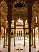  Oblong court that was surrounded by 124 slender columns
o Each column connects to an arch that uses muqarnas
 The columns and muqarnas arches were supposed to be reminiscent of palm 
trees that let light in but create patterns of shadow on the ground
o Lion fountain in the middle – this representation is okay because this building is 
not religious
 Supported by twelve lionesses
 Not designed with anatomical accuracy but intended to show 
strength/power
 Muhammad V was the engineer who built the fountain
 Utilized a complex hydraulics system
 Each hour, a lioness would produce water from its mouth as a clock 
would
 The fountain apparently baffled all who saw it, even inspiring a poem 
on the fountain by Ibn Zamrak which speaks about this idea
o Fountain sat at the middle of two water channels that formed a cross in the 
courtyard
 Water flows through  suggestive of life-giving
 Water  created a sense of harmony, tranquility
 Water is a major decorative element in Islam that promotes reflection, 
cooling, and peaceful qualities
 4 arms to the two water channels  associated with the four rivers of 
Paradise
 12 lions  twelve signs of the Zodiac