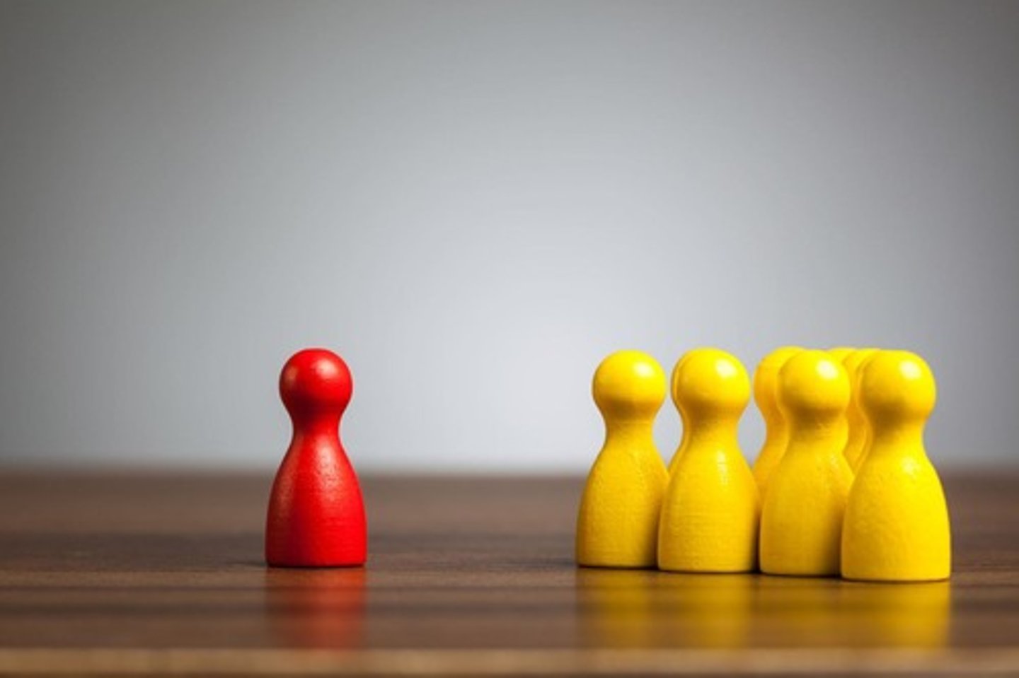 <p>Not making eye contact and positioning oneself away from the group.</p>