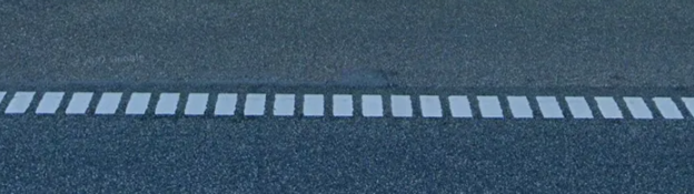 <p>Small white squares on outer road</p>