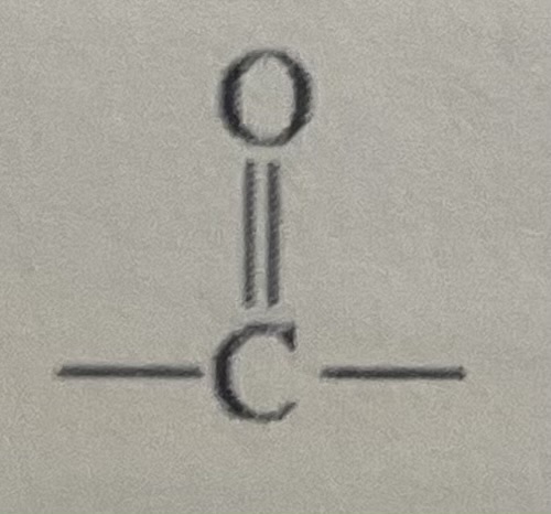 <p>Carbonyl group (carbon-oxygen double bond) between carbon atoms</p>