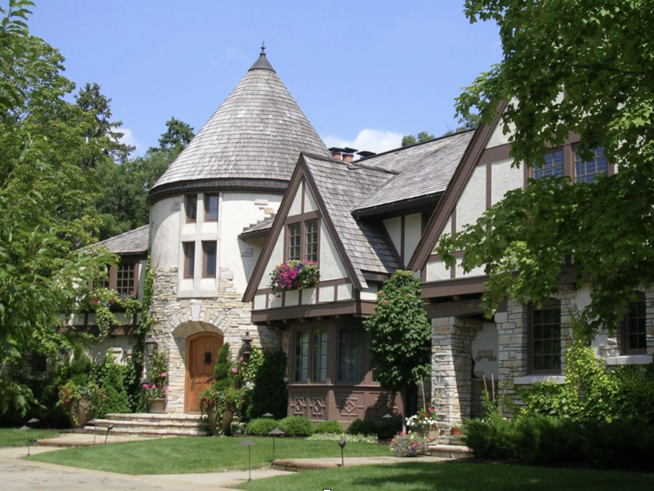 <p>Large chimneys with decorative tops</p><p class="p2"></p><p class="p1">Arched front entry with small pronounced porch </p><p class="p2"></p><p class="p1">Asymmetrical</p>