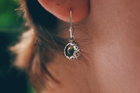 <p><span>a </span>piece<span> of </span>jewellery<span>, usually one of a </span>pair<span>, </span>worn<span> in a </span>hole<span> in the </span>ear<span> or </span>fastened<span> to the </span>ear<span> by a clip</span></p>