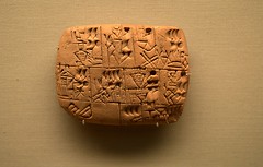 a system of writing used in ancient Mesootamia, in which wedge-shaped characters were produced b pressing a stylus into a soft clay tablet, which was then baked or otherwise hardened