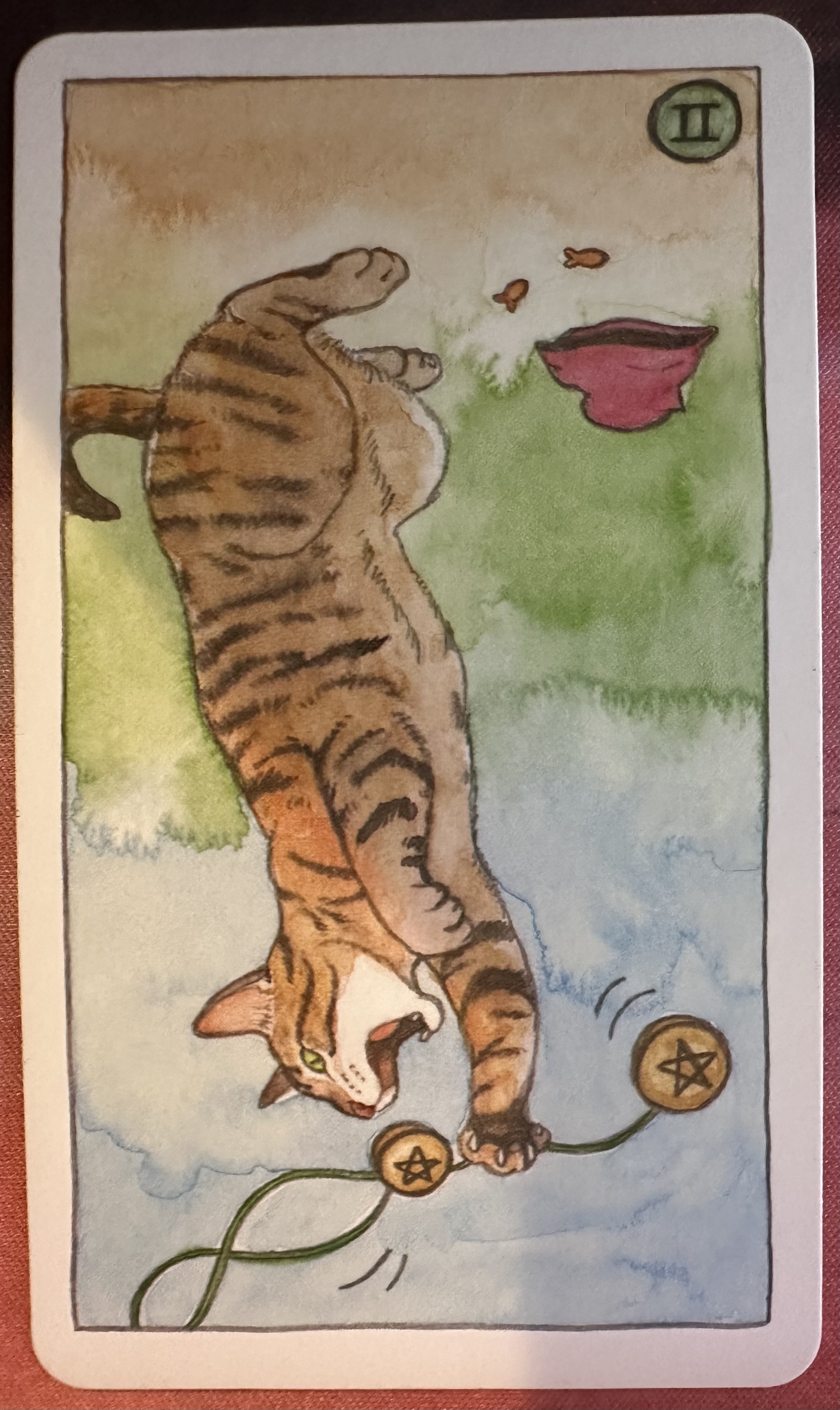 <p>Two of Pentacles (II) Reversed</p>