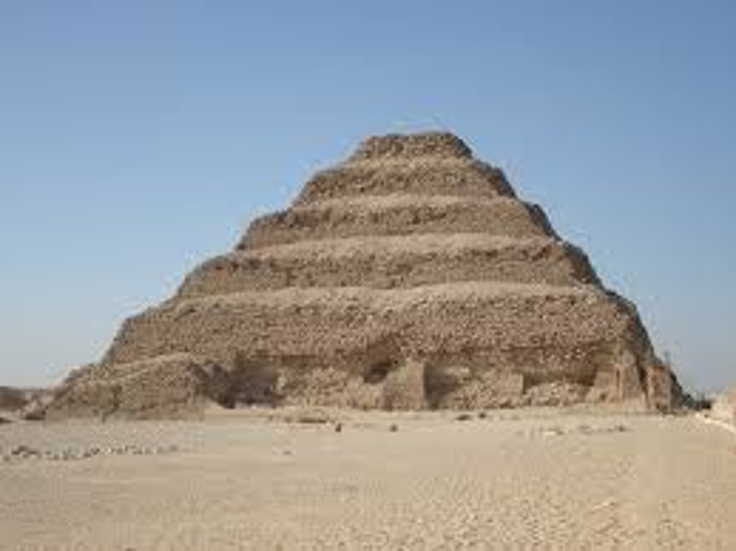 <p>- Built for Pharaoh Djoser at Saqqara around 2650 BCE by architect Imhotep</p><p>- The first monumental stone structure in Egypt — a revolutionary architectural achievement</p><p>- Consists of six mastaba-like steps rising to ~60 meters</p><p>- Surrounded by a large walled funerary complex with temples and dummy buildings</p><p>- Marked the beginning of Egypt's pyramid-building tradition</p>