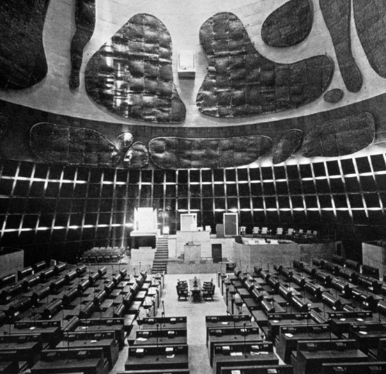<p>This is the <strong>General Assembly/Congress building</strong> in <strong>Chandigarh, India</strong><span><strong>,</strong>&nbsp;designed by&nbsp;<strong>Le Corbusier</strong>. The acoustic panels' “painterly strokes” identify it as his work</span>.</p>