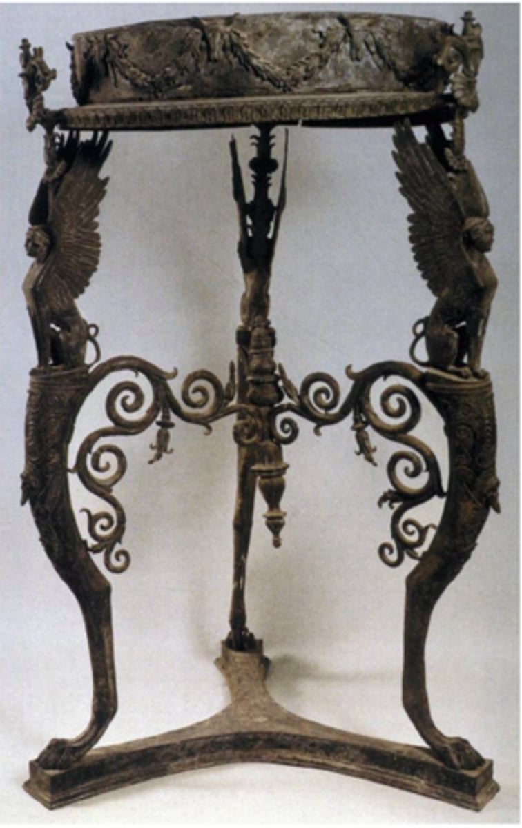<p>Roman</p><p>three legged table</p>