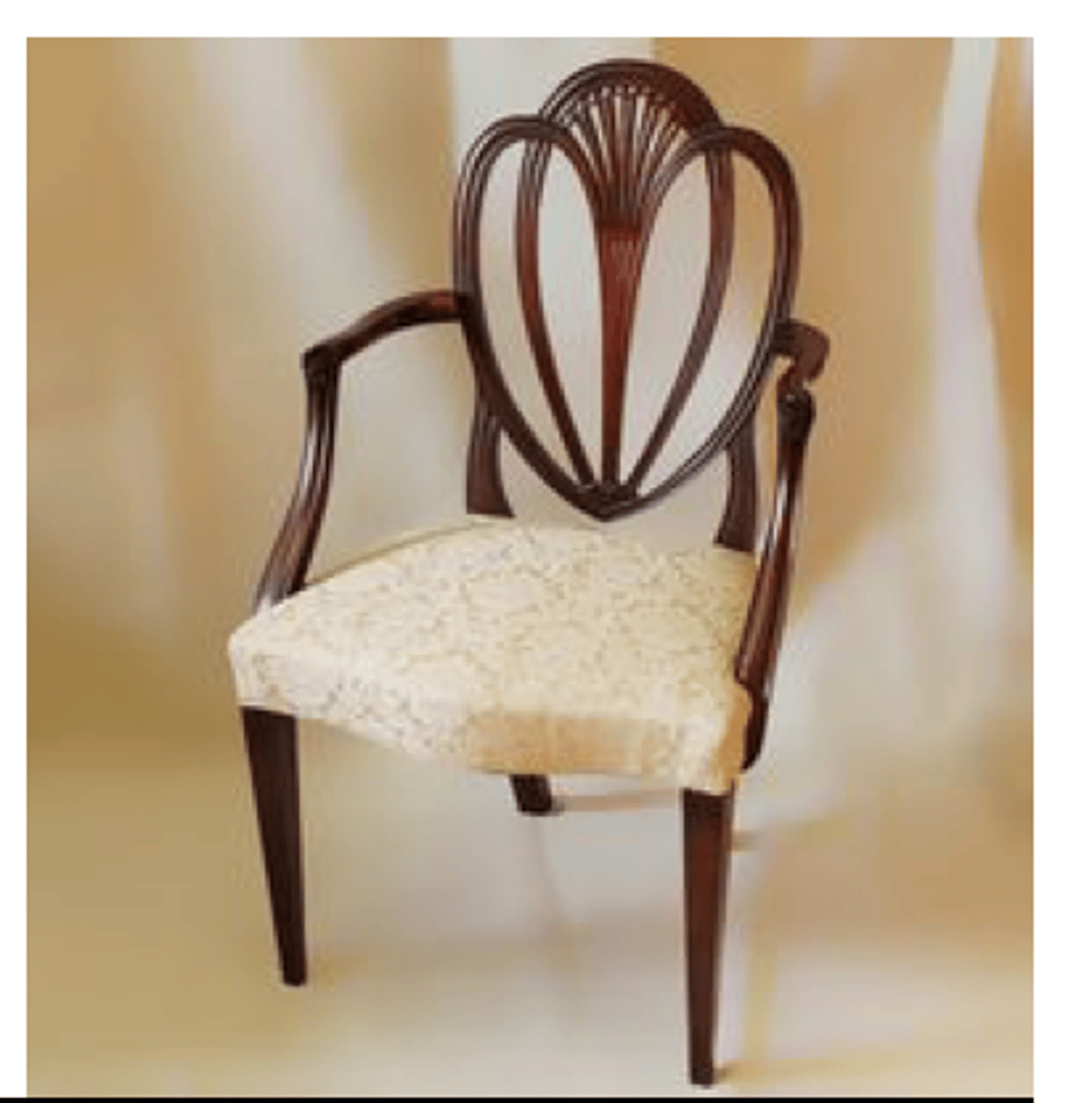 <p>Hepplewhite chair with a backrest resembling two overlapping hearts, hence the name.</p>