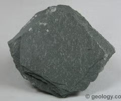 <p>metamorphic, fine foliated, splits into thin plates, dark red/gray color, smooth surface. harder/denser than shale and makes a high pitched sound when tapped against a surface.</p>