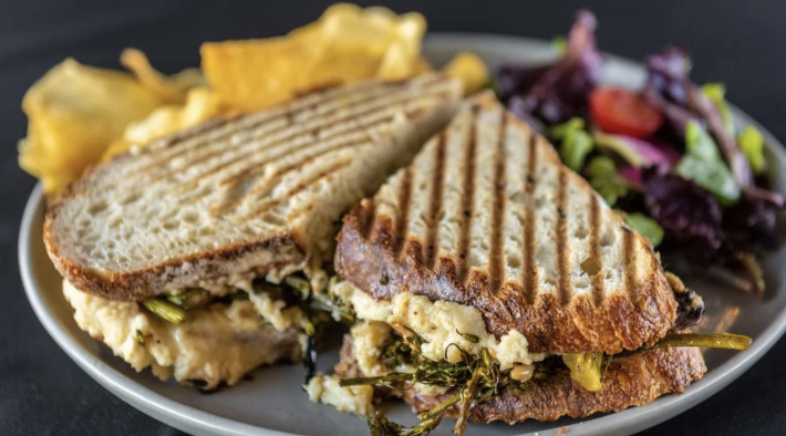 <ol start="6"><li><p>Sandwiches (Served with House Chips and Organic Mixed Greens):Braised Broccolini Sandwich $14 (Vegan)</p></li></ol><p></p>