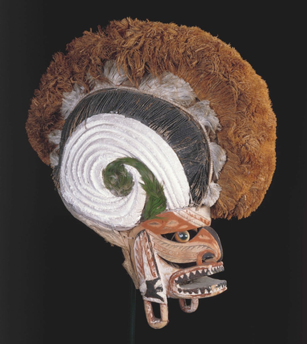 <p>New Ireland Province, Papua New Guinea</p><p>c. 20th century CE</p><p>Form: Wood, pigment, fiber, and shell</p><p>Function: The symbols refer to the person it was made for, designed to honor their clan</p><p>The masks of Papua New Guinea cultures were extremely intricate and were embedded with a great deal of meaning. Using symbols that refer to the person it was made for and to honor their clan. Some were made to represent spirits, or the life force of the deceased rather than a portrait-like representation. Malagan ceremonies were large, typically multi-day events held to honor someone who has died and to help send their souls to the other world. Once the ceremonies were complete, the sculptures were typically destroyed or allowed to rot away. The object served a single use purpose and would not be used again.</p>