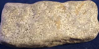 <p>Typically a light tan in texture, this rock is made from tiny round grains that look like little balls. It is well sorted, and well rounded. It has a fine to medium grain size.  </p>