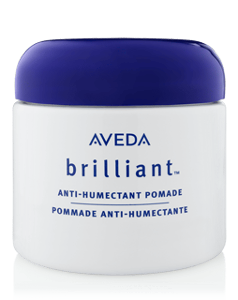 <p>hairdressing consisting of a perfumed oil or ointment</p>