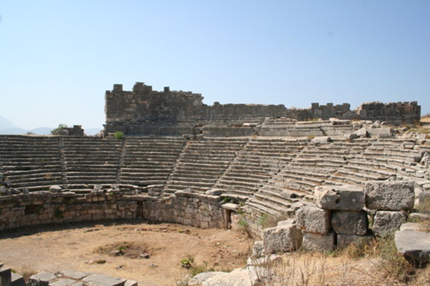 <p>the tiered, semicircular seating area in an ancient Roman theater</p>