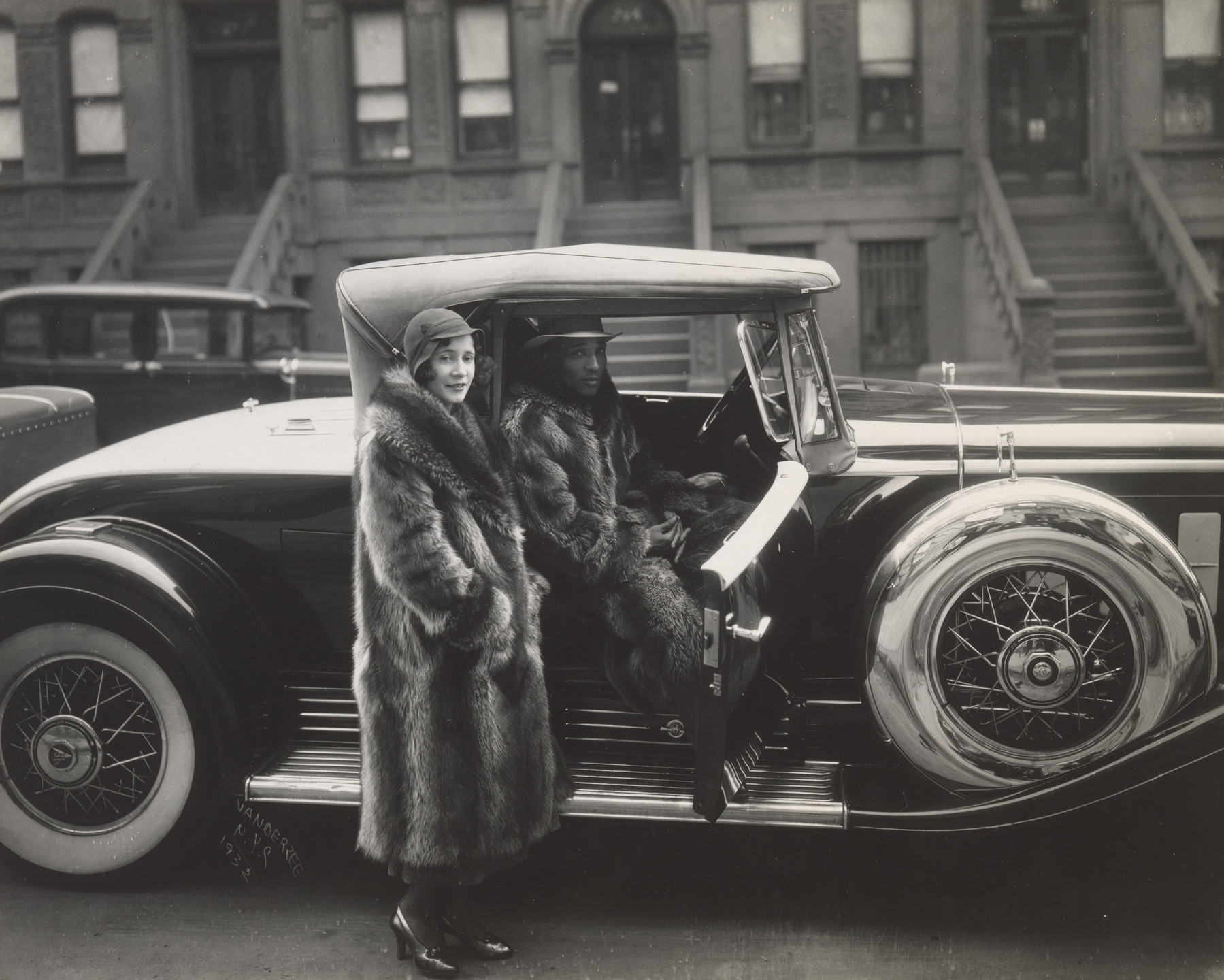 <p>Who photographed "Couple Wearing Raccoon Coats with a Cadillac" in 1932?</p>