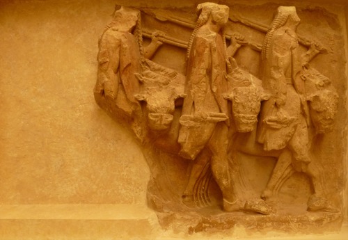 575-550BC, Sikyonian Treasury Delphi

Storyline: 
Castor and Pollux aspired to marry the Leucippides ('daughters of the white horse'), Phoebe and Hilaeira, whose father was a brother of Leucippus ('white horse'). Both women were already betrothed to cousins of the Dioscuri, the twin brothers Lynceus and Idas of Thebes. Castor and Pollux carried the women off to Sparta, wherein each has a son. This consequently started a family feud between the four sons of the two brothers Tyndareus and Aphareus. The cousins carried out a cattle-raid in Arcadia together, but fell out over the division of the meat. The story went that after they had stolen the herd, but before they had divided it, the cousins killed, cooked, and divided a calf into quarters. As they prepared to eat, the gigantic Idas suggested that, based on whichever pair of brothers finished their meal first, the herd would be divided into two. Castor and Pollux agreed, but Idas tricked them, by eating both his and his brother's portion. Castor and Pollux let them take the herd, but vowed one day to take their revenge. Some time later, Idas and Lynceus visited their uncle in Sparta. However, he was on the way to Crete, so he left Helen to entertain the guests, which included both sets of brothers, as well as Paris. Castor and Pollux realised their chance for revenge, and left early, planning to steal the herd of Idas and his brother. Eventually, Lynceus and Idas also left, which gave Paris a chance to kidnap Helen, thus giving rise to the events of the Trojan War. Meanwhile, Castor and Pollux were stealing cattle, the former keeping watch in a tree. As the other two brothers approached, Lynceus saw Castor in the tree, and realised what was happening. Idas, furious, fatally wounded Castor, but not before he called out to warn Pollux, who killed Lynceus in retaliation. As Idas was about to kill Pollux, Zeus looked down and killed him with a lightning bolt, to save his beloved son. 
 
How do we know it's archaic? 

* Repetition of patterns and figures 
* All the figures look the same and wear the same clothes, despite the different status of each 
* Unnatural position of cattle (head to the front, legs to the side) 
* Lots of vertical lines through the figures, diagonal lines with the spears, and triangles 
* They are all walking in step, in a tightly knit pattern