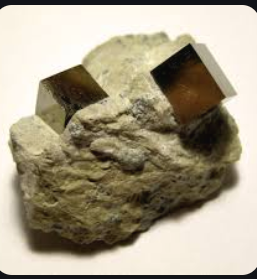 <p>is a texture in igneous and metamorphic rocks where crystals are well-formed with distinct faces, typically indicating a slow growth rate in a cavity or space. </p>