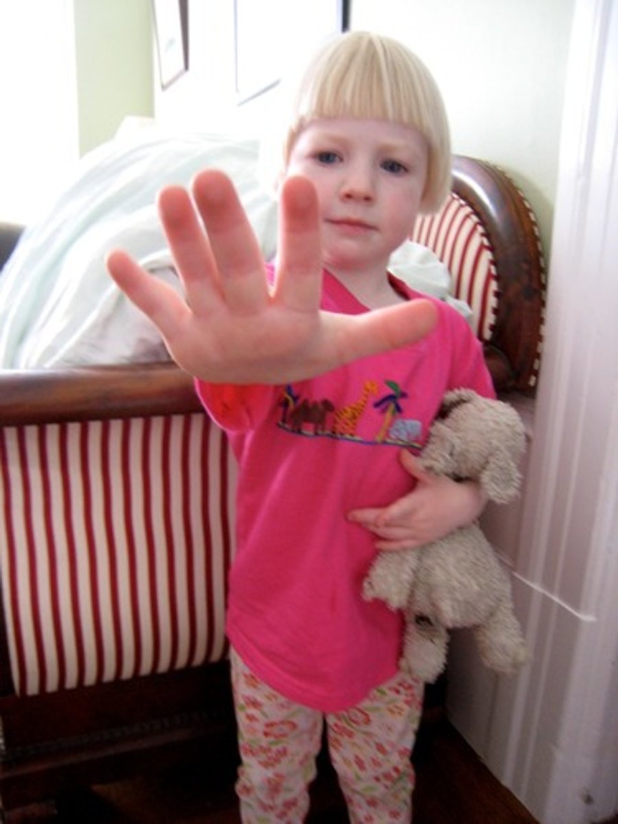 <p>Not wanting to do something; unwilling.</p>