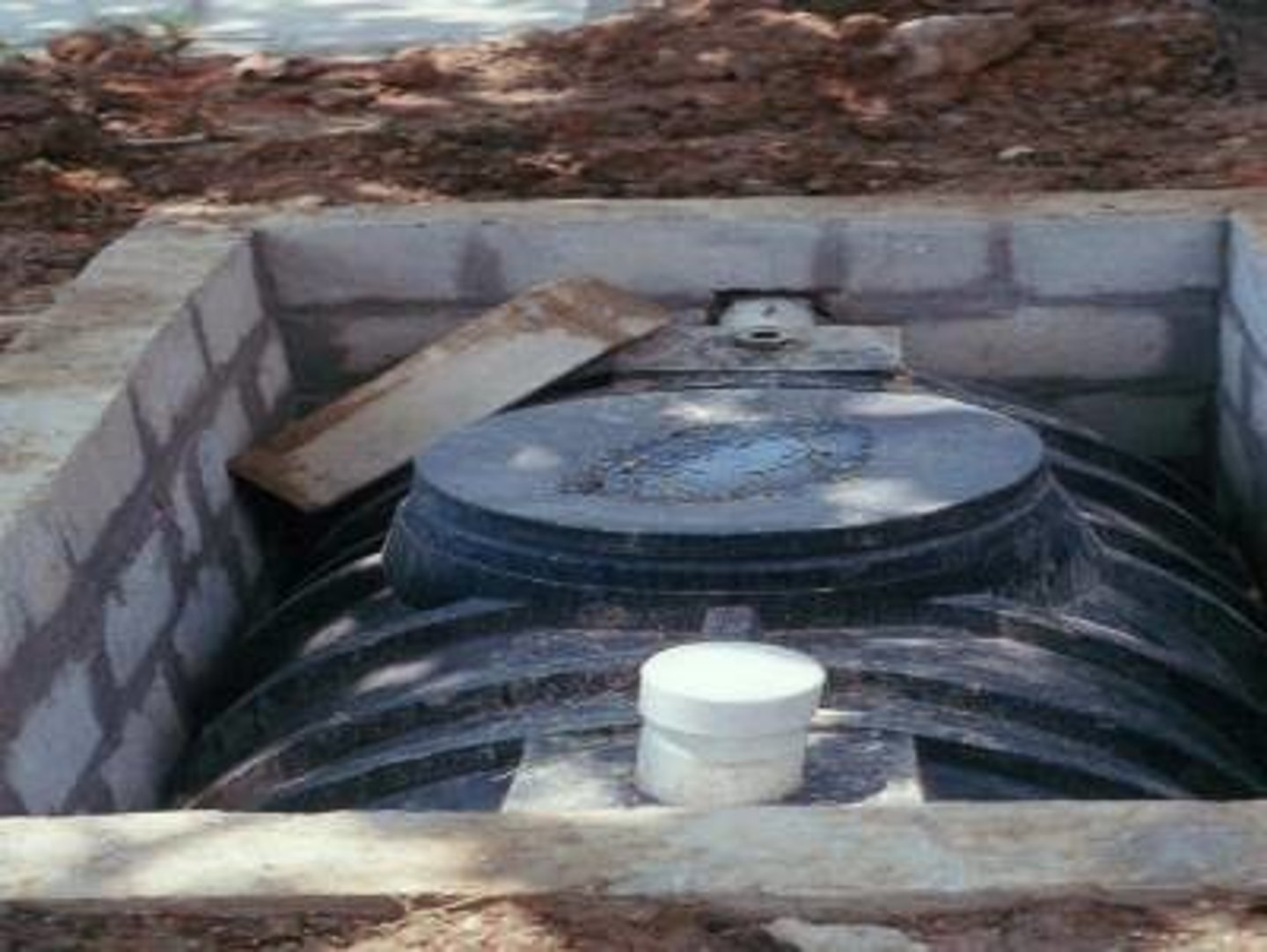 <p>A large container that receives wastewater from a house as part of a septic system</p>