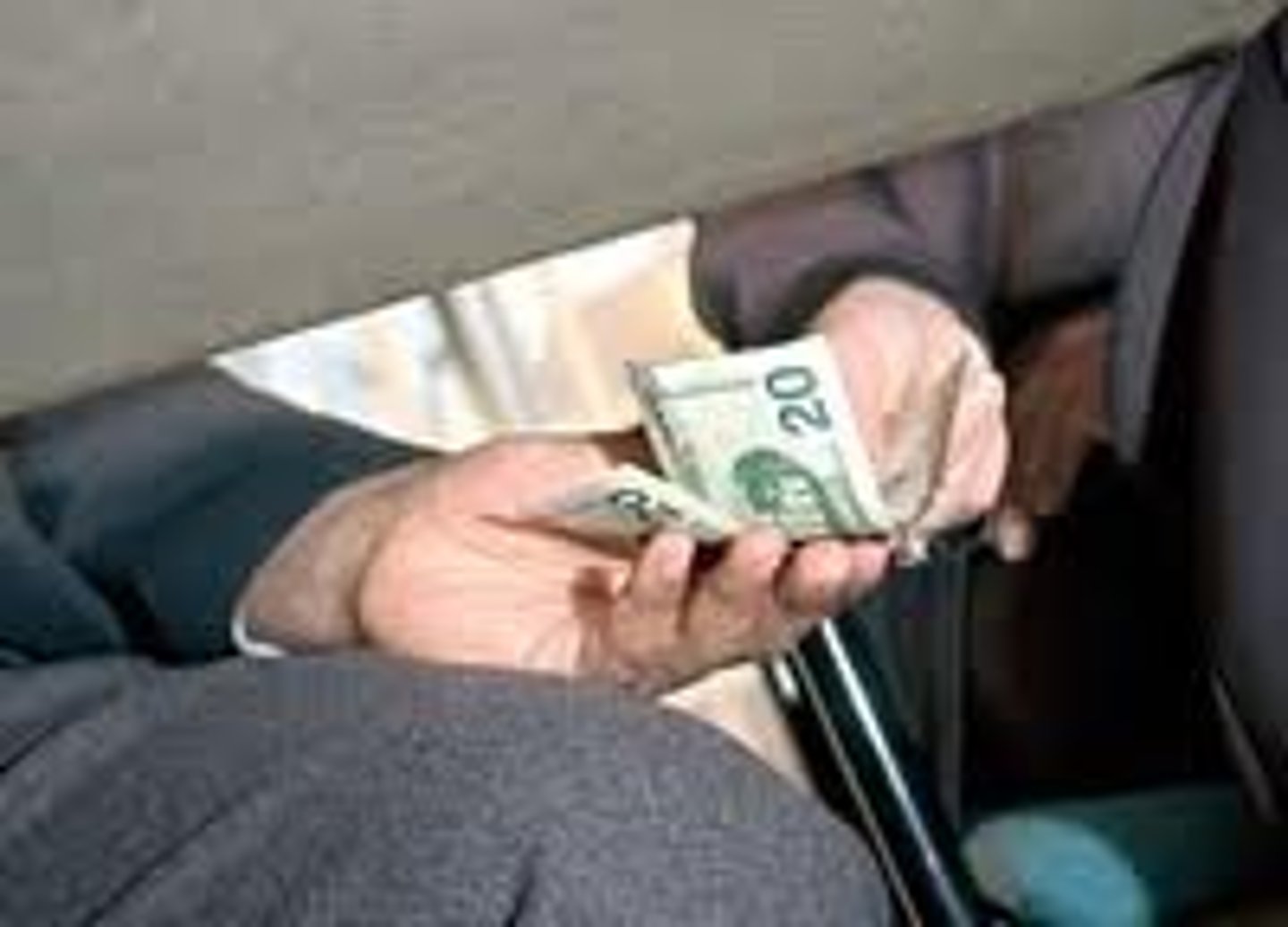 <p>the acquisition of money in dishonest ways, as in bribing a politician, to pay off someone to gain something</p>