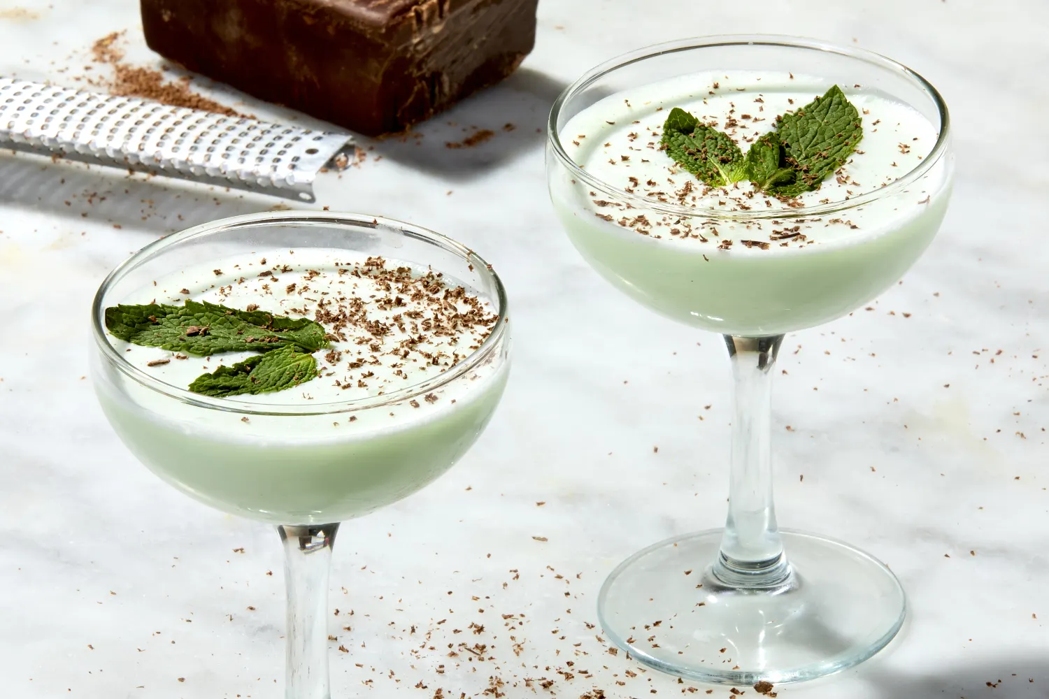 <p>coffee/cream, 1 oz green creme de menthe, 1 oz creme de cacao, 1 oz heavy cream, served straight up, garnished with mint</p>