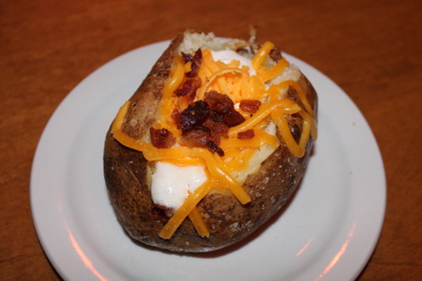 <p>Butter, sour cream, cheddar cheese, bacon bites</p>