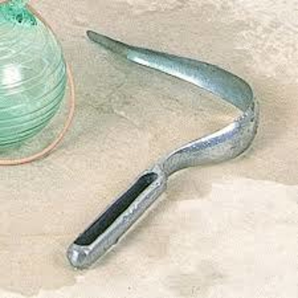 <p>an instrument with a curved blade used, especially by ancient Greeks and Romans, to scrape sweat and dirt from the skin in a hot-air bath or after exercise; a scraper.</p>