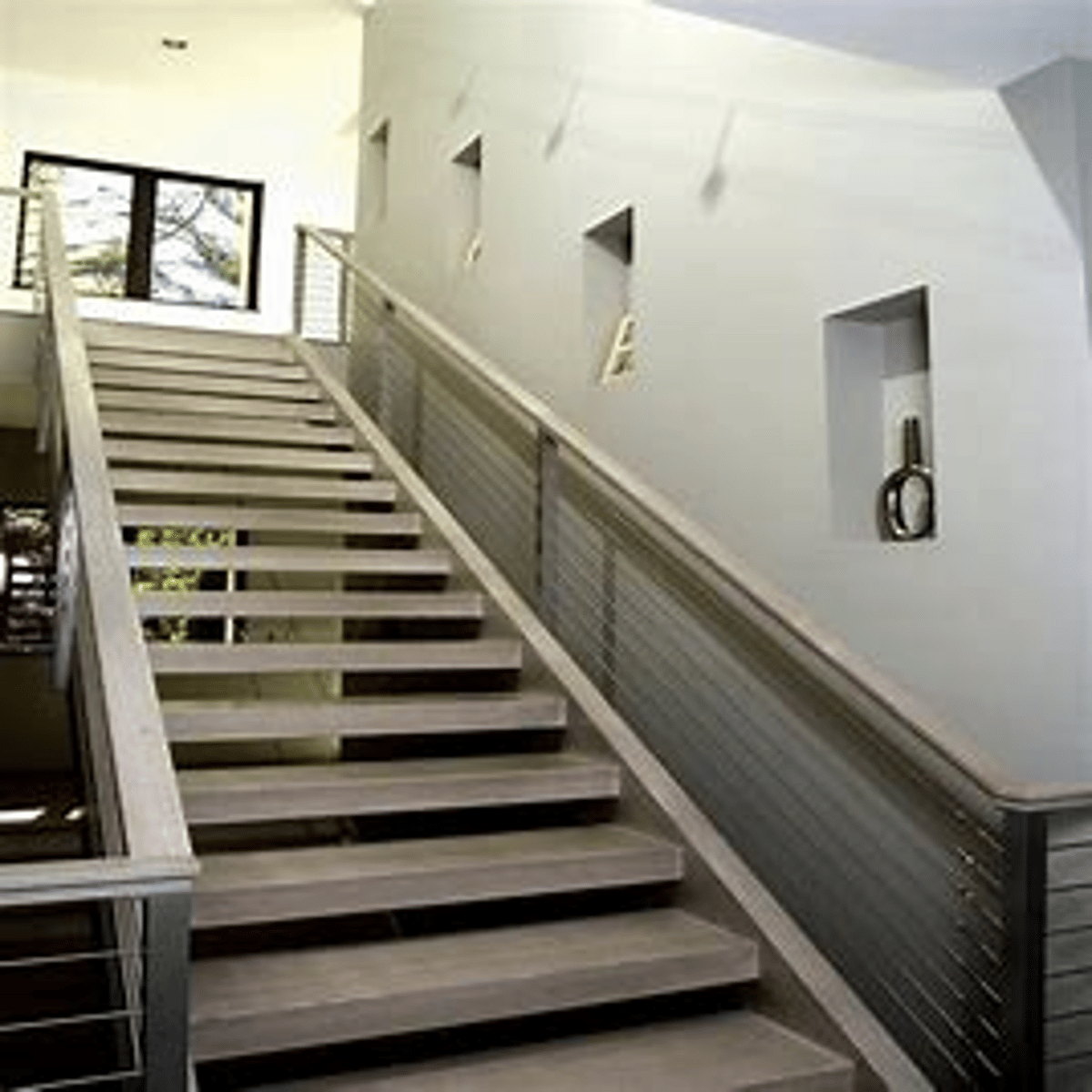 <p>a stair extending from one level to another without turns or winders</p>