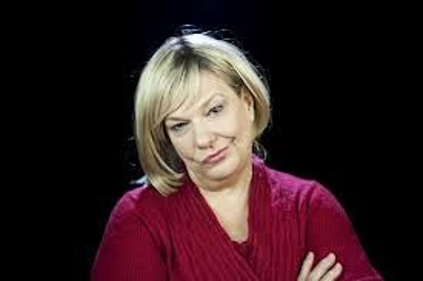 <p>saying things that are the opposite of what you mean, in order to make an unkind joke or to show that you are annoyed</p>