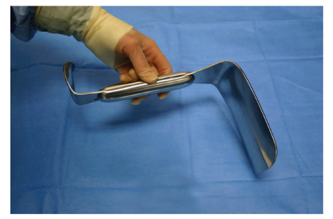 <p>Nickname: Joe’s Hoe, Vagotomy Retractor</p><p>Use: Retracts deep intestinal tissue</p><p>Features: Very heavy, smooth, oblong handle with reversed right angle double-ended toe in, blunt tips. Weights approximately 2 pounds or 8 times more than most retractors</p>