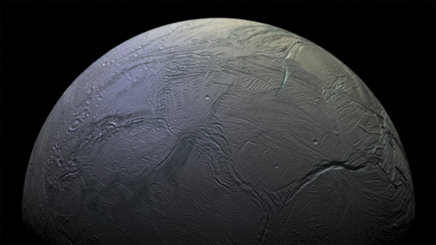 <p>What is the surface composition of this moon?</p><p>What is unusual about the surface of this small moon?</p>