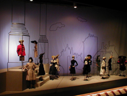 <p>1945-46 exhibition that featured life like dolls, resembling mannequins that would travel to raise funds during the war for the Paris fashion industry</p>