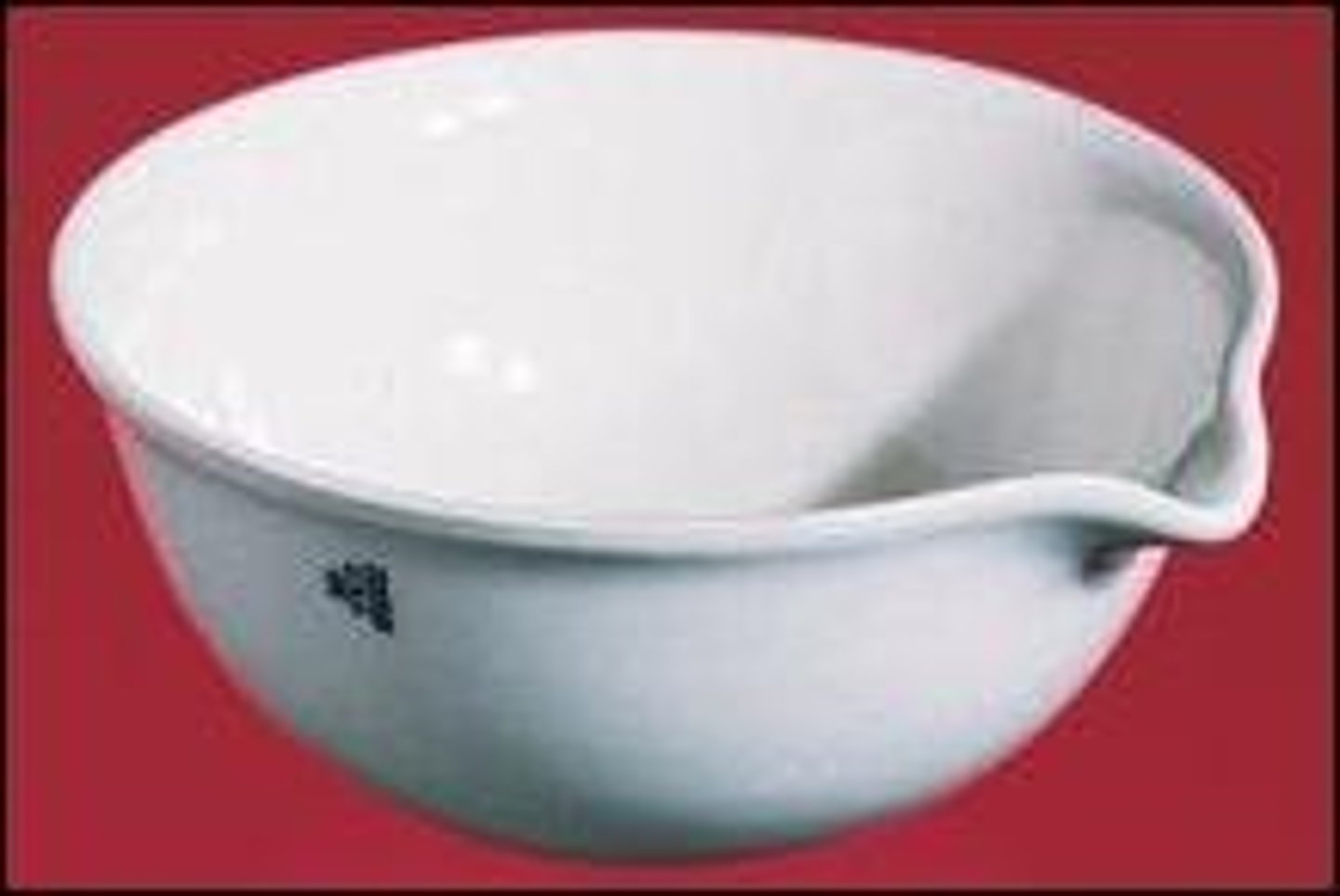 <p>made of porcelain; used to heat substances, often to remove water</p>